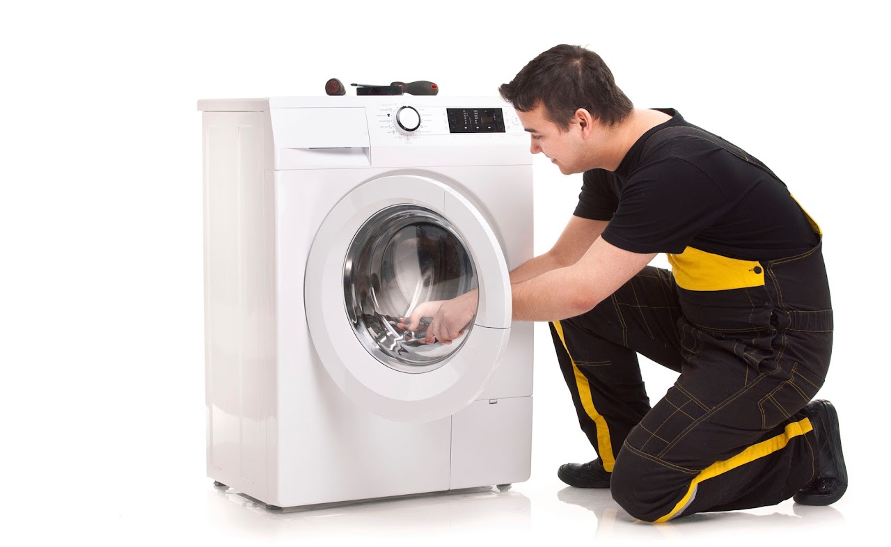 studio photo of washing machine repairman